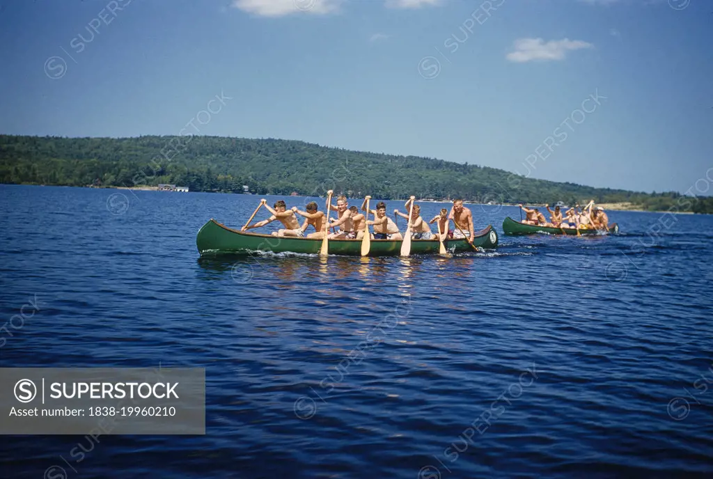 Camp Boys rowing Canoes, Camp Sunapee,  New Hampshire, USA, Toni Frissell Collection, July 1955