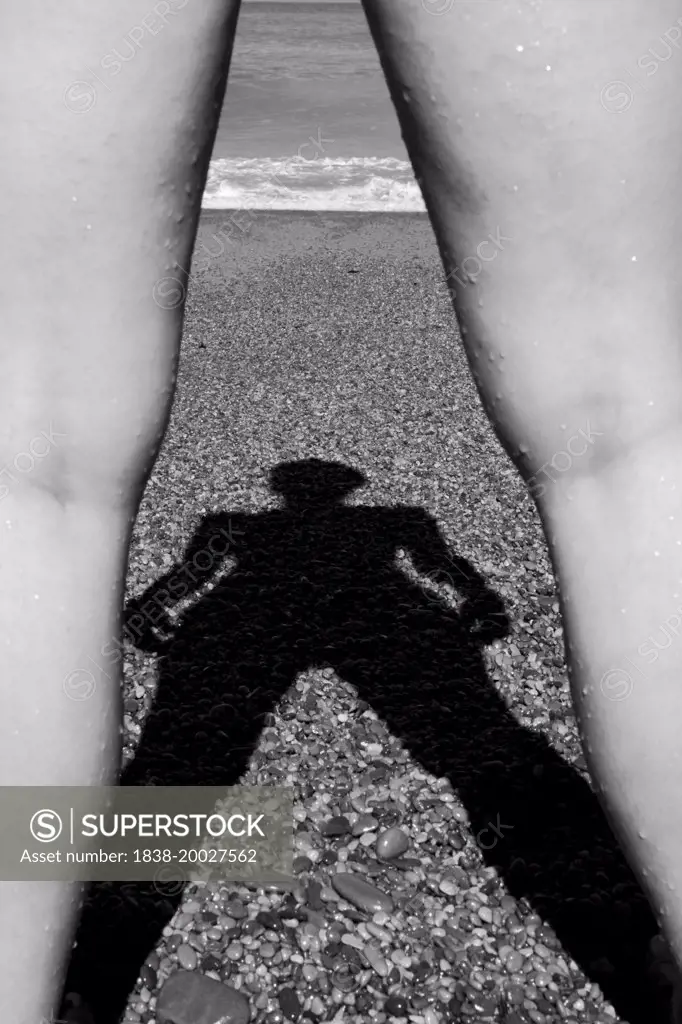 Shadow of Women Between Two Legs on Beach