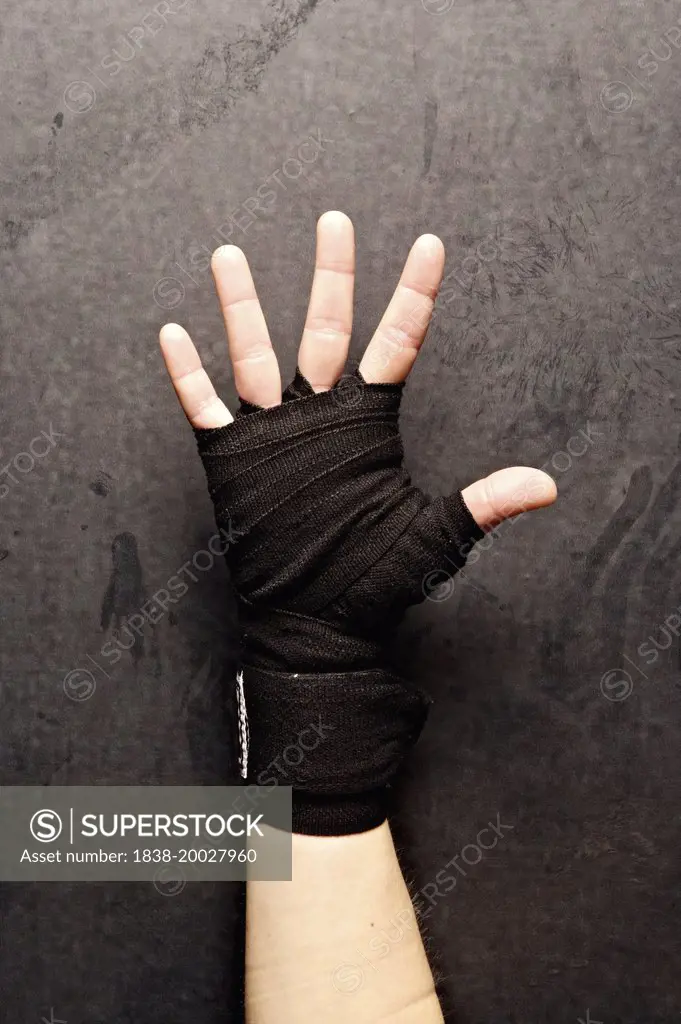 Boxer's Hand Wrapped in Black Tape