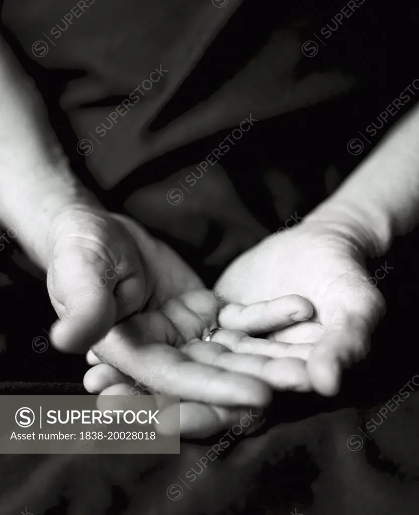 Elderly Man's Hands Facing Up in Lap