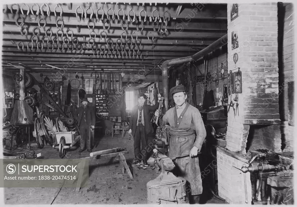 Blacksmith in Cartwright shop, circa 1890