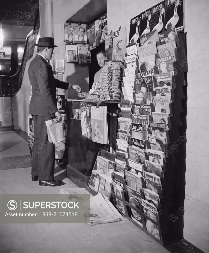Man Buying Newspaper at Newsstand, Washington DC, USA, circa 1940