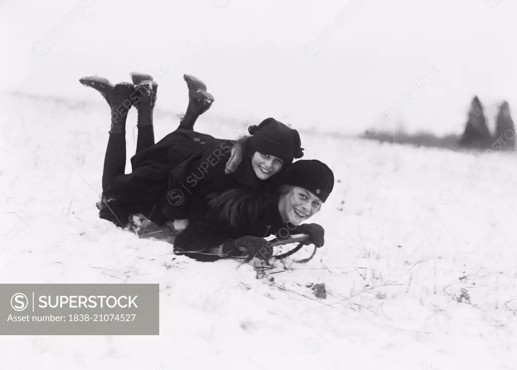 Two Smiling Girls on Snow Sled, Washington DC, USA, circa 1920