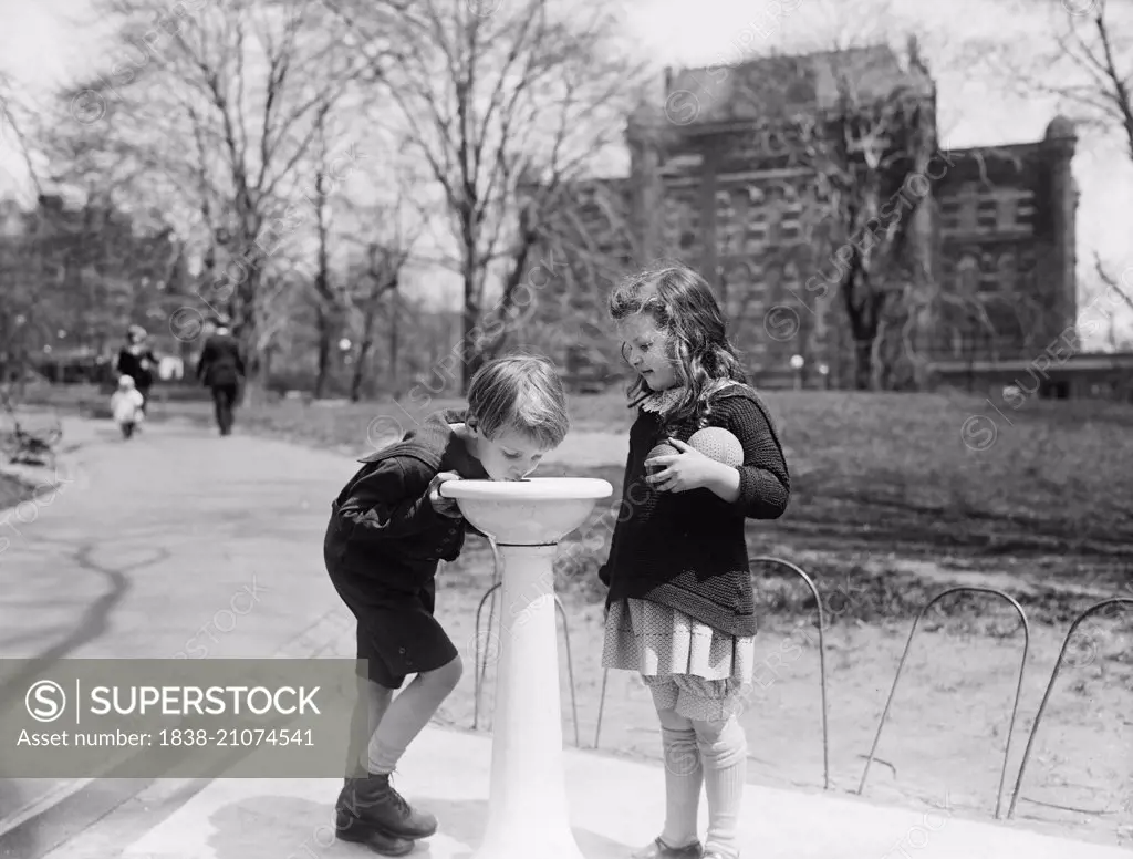 Two Children at Water Fountain in Park, Washington DC, USA, circa 1924