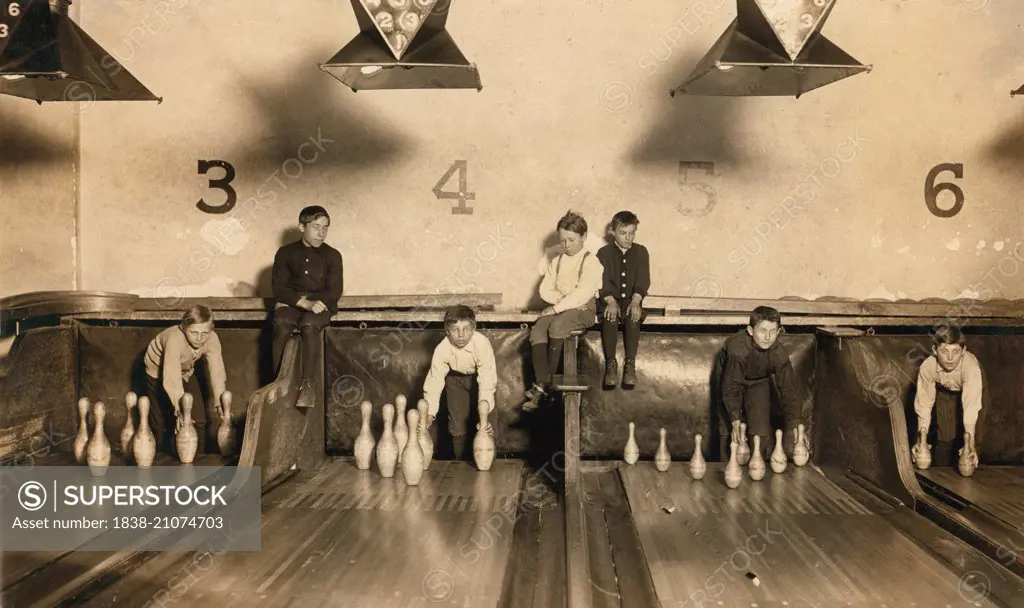 Young Boys Setting Up Bowling Pins at Arcade Bowling Alley Late at Night, Trenton, New Jersey, USA, circa 1909