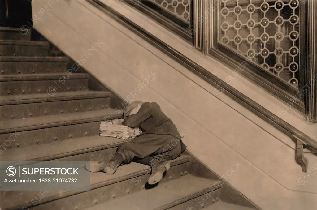 Young Newsboy Sleeping on Stairs with Newspapers, Jersey City, New Jersey, USA, circa 1912