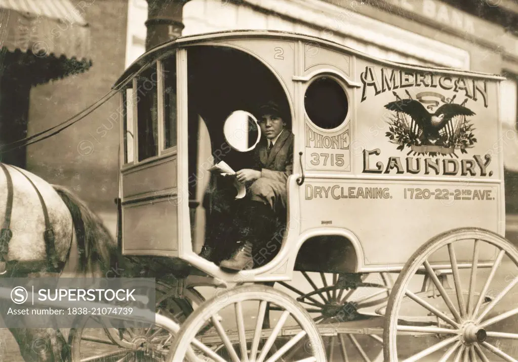 Young Boy Driving Laundry Delivery Wagon, Birmingham, Alabama, USA, circa 1914