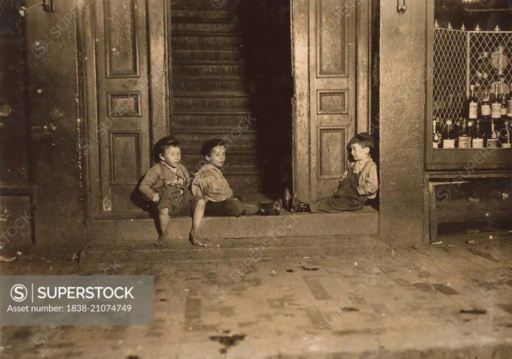 Three Young Children Hanging Out in Doorway Late at Night, Boston, Massachusetts, USA, circa 1909