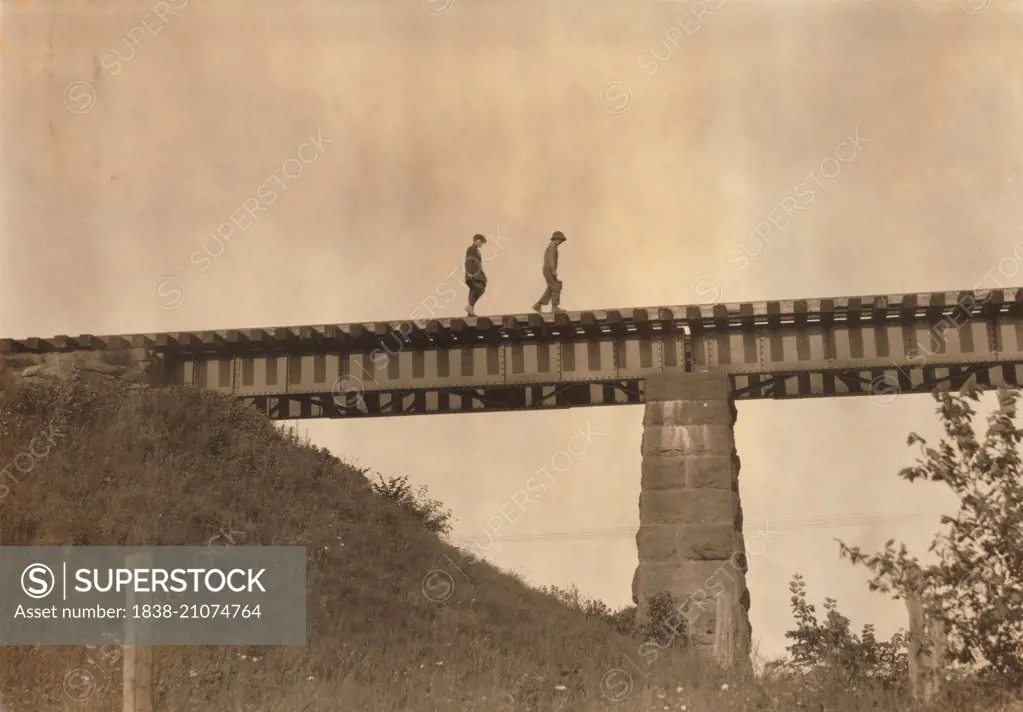 Two Young Boys Walking Along Elevated Train Track, Westfield, Massachusetts, USA, circa 1916