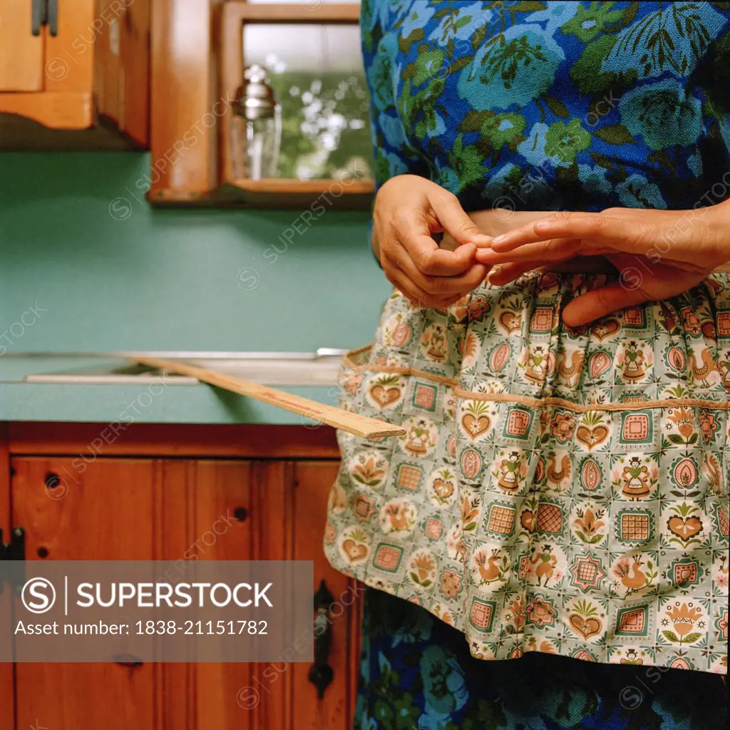 Woman Wearing Apron in Kitchen