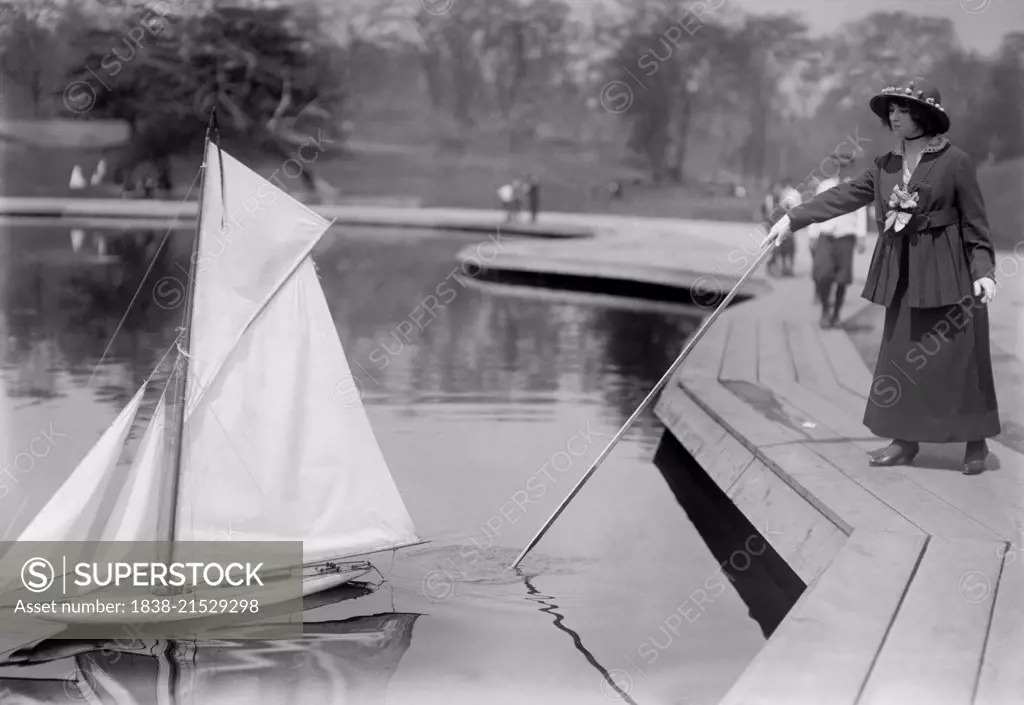 Woman with Model Yacht, Conservatory Lake, Central Park, New York City, New York, USA, Bain News Service, 1915
