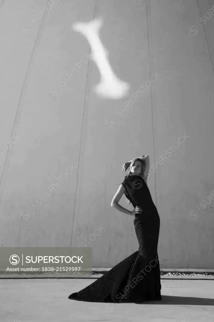 Outdoor Fashion Portrait of Young Adult Woman in Long Black Dress 