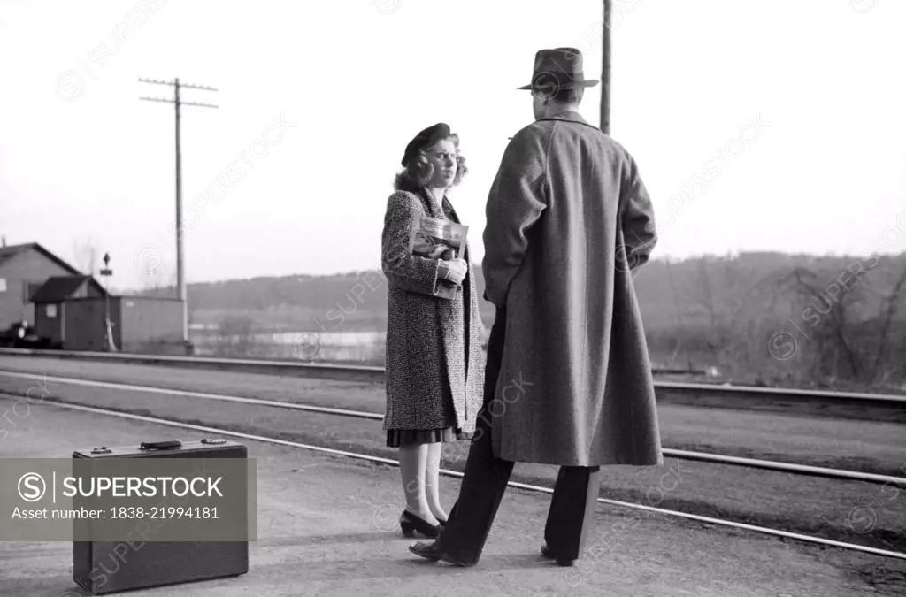 Couple Waiting for Train to Minneapolis, East Dubuque, Illinois, USA, John Vachon for Farm Security Administration, April 1940