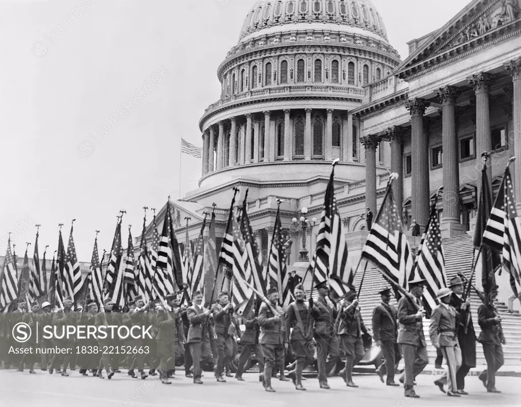 Bonus Expeditionary Forces, many Carrying American Flags, Marching across East Plaza of U.S. Capitol during Bonus Demonstration as Congress Struggled with Deficit, Washington DC, USA, Underwood and Underwood, April 8, 1932