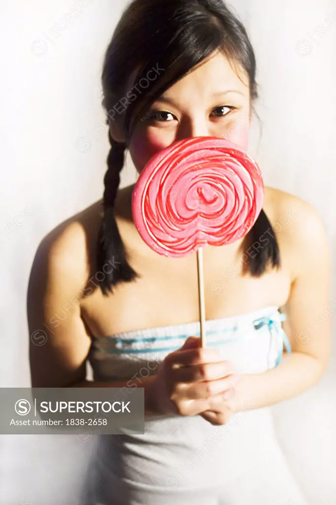 Girl Holding Pink Lollipop