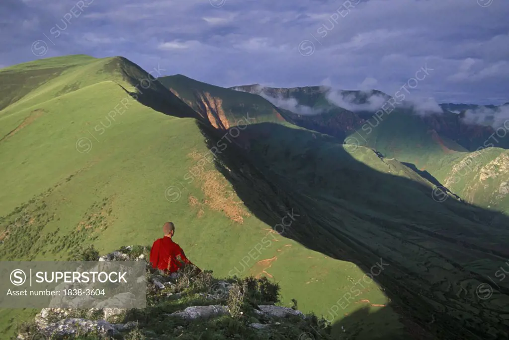 Monk Meditating on Mountaintop