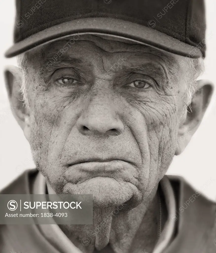 Portrait of Older Man in Baseball Cap 
