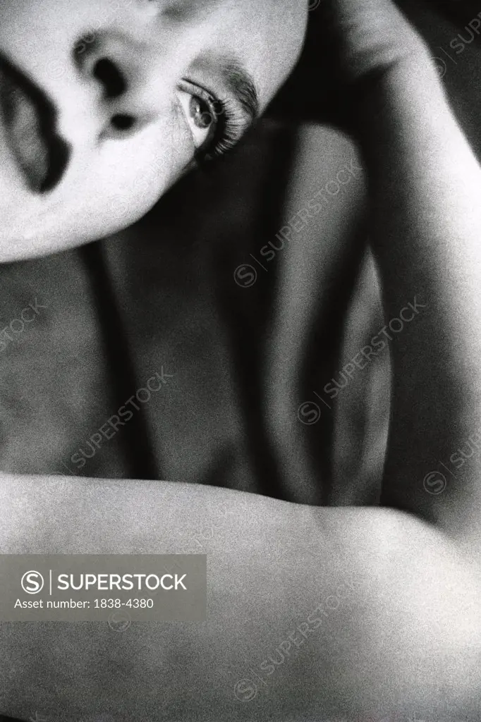 Dramatic Woman Leaning on Arm  