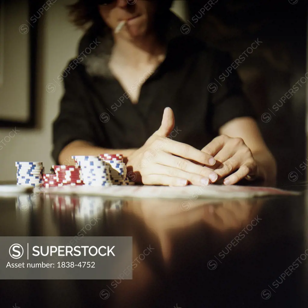 Young Gambling Man Playing Poker