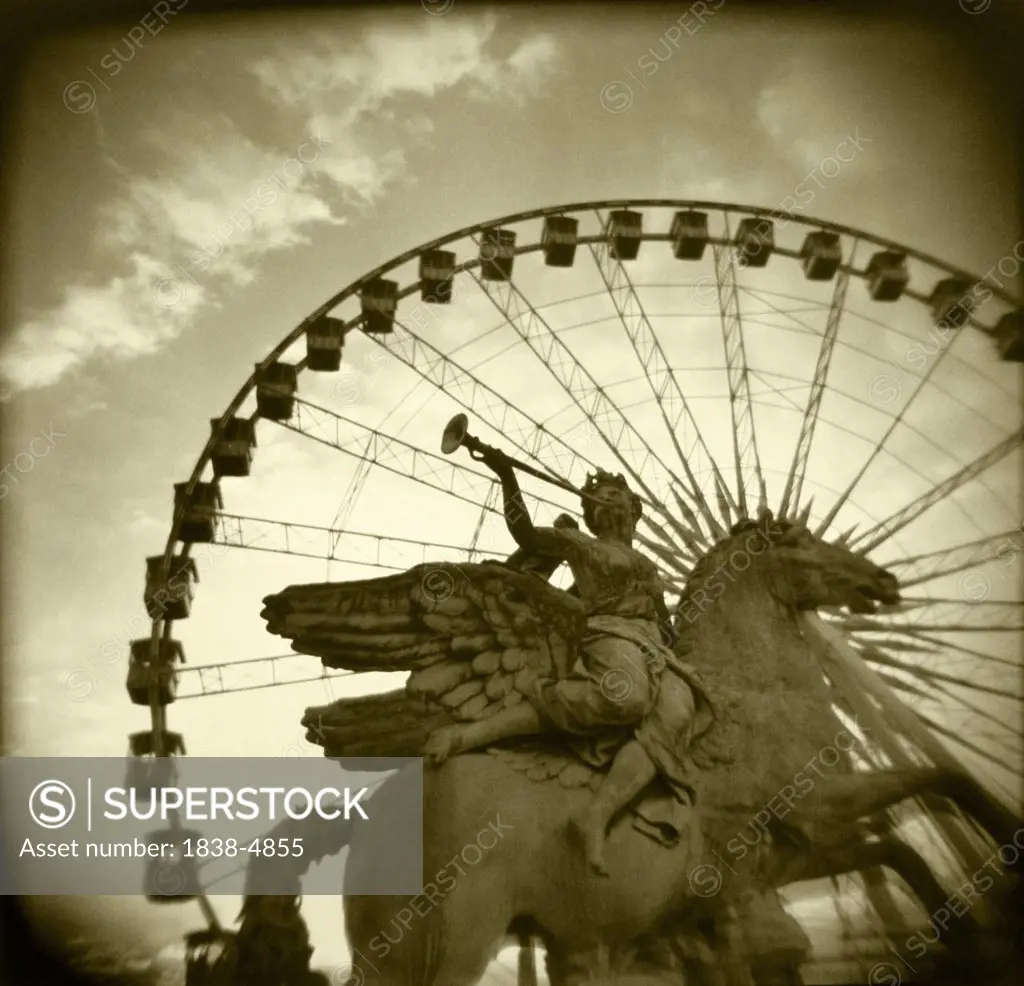 Statue and Ferris Wheel