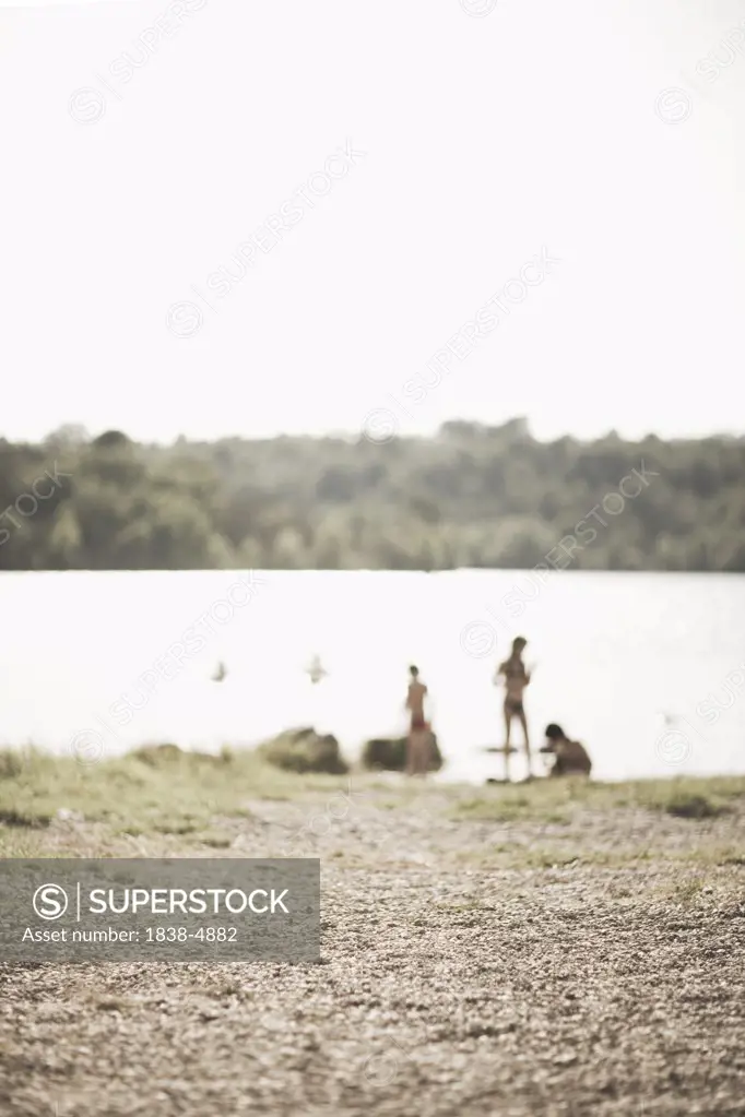 Blurred Kids Playing by Lake, Provence France