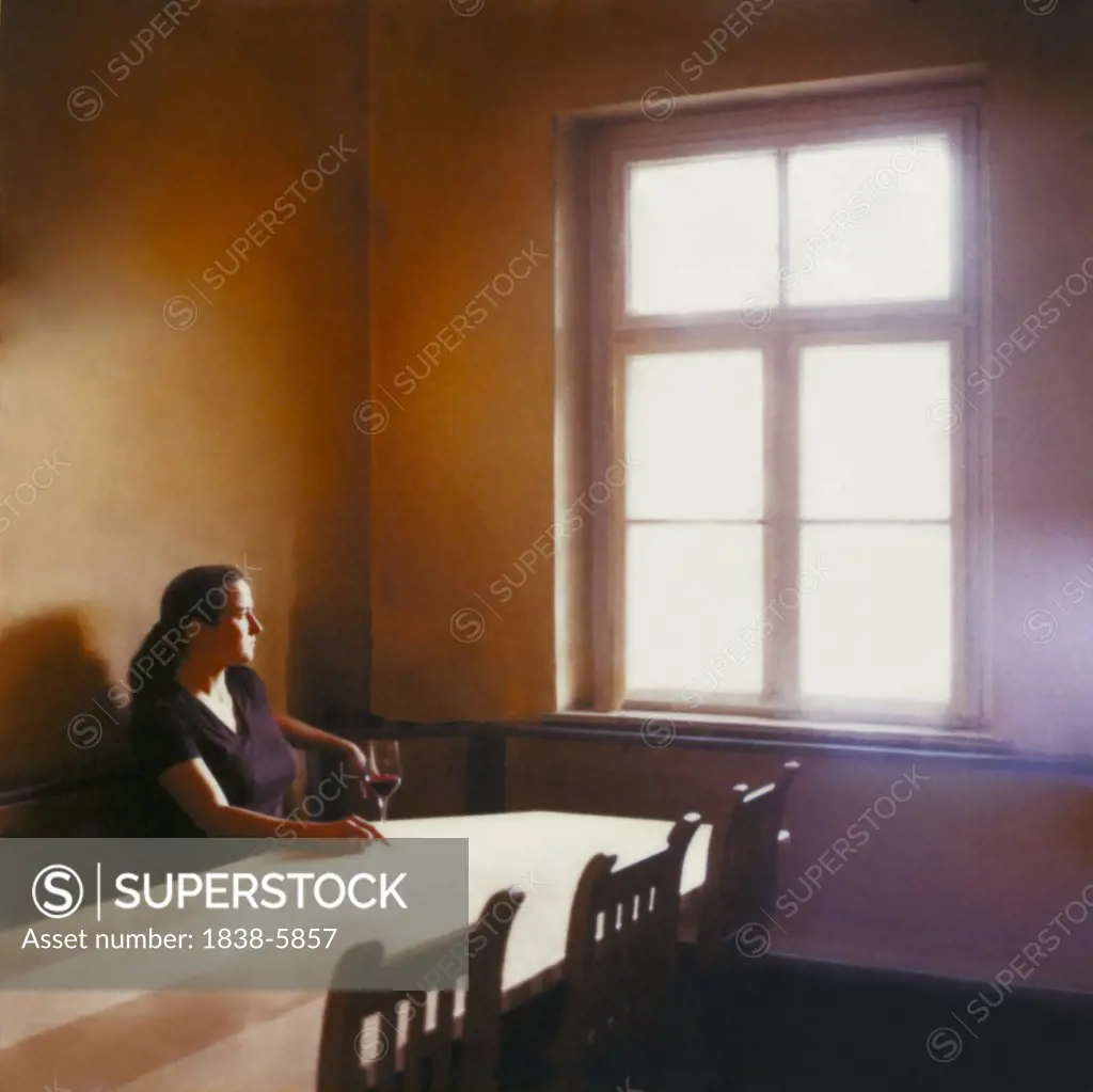 Woman watching at a window
