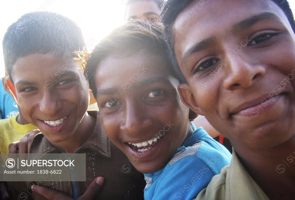 Three Teen Boys Smiling