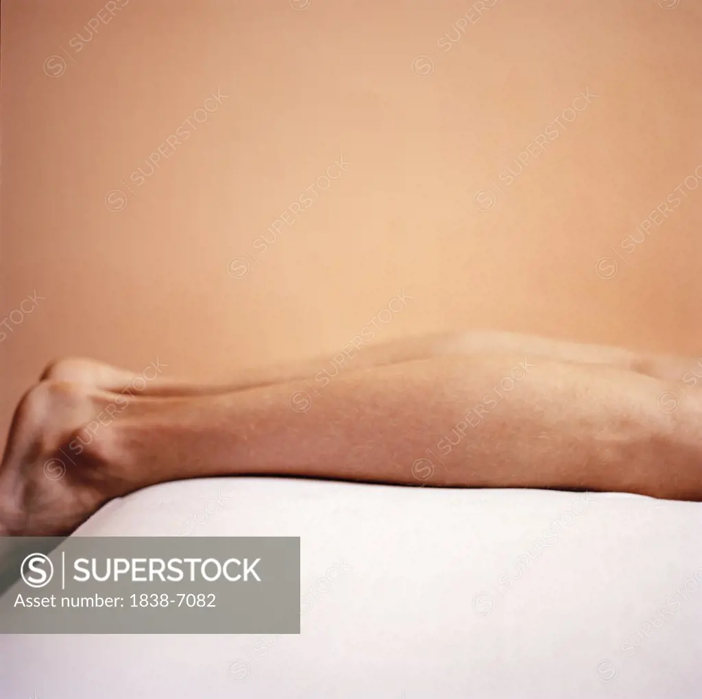 Male Legs, Close Up While Lying on Bed