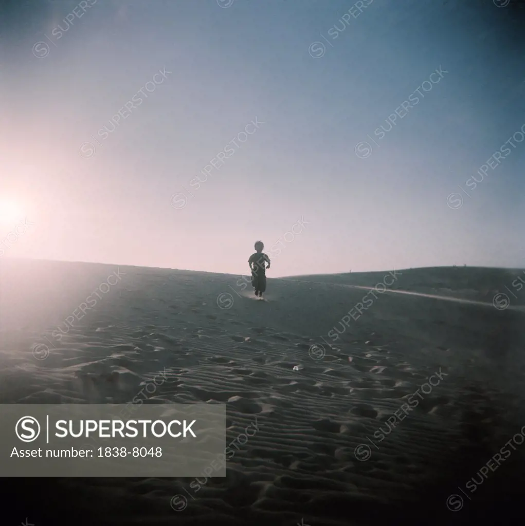 Young Boy Standing in Desert, Silhouette, Vietnam