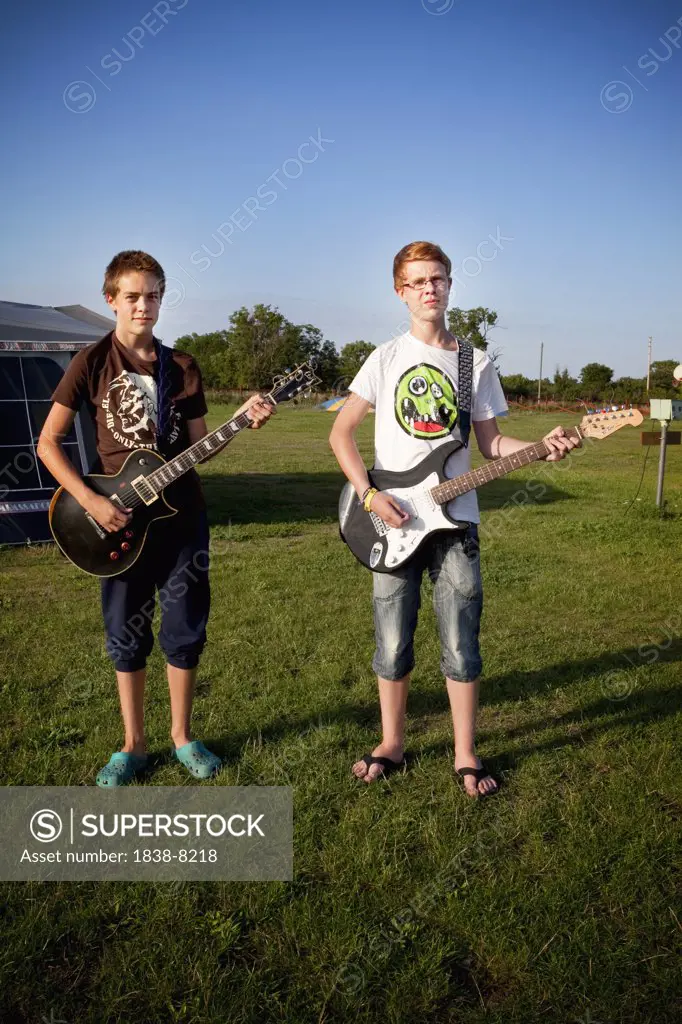 Two Boys Playing Guitars