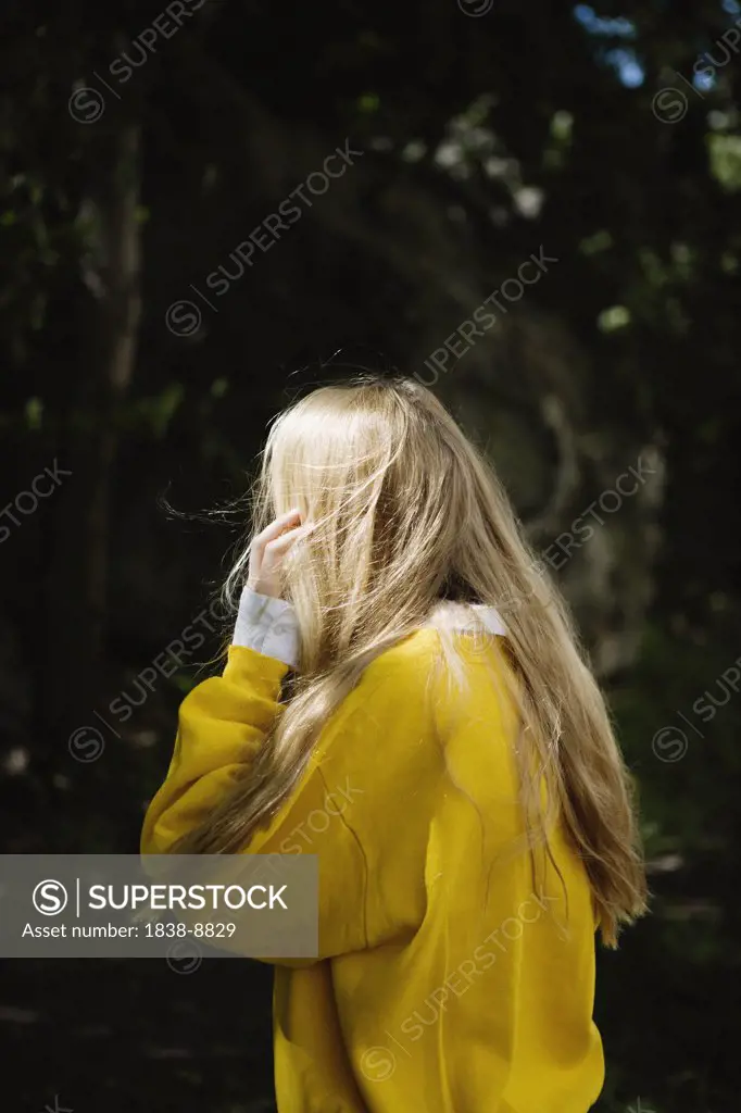 Blonde Girl in Yellow Sweater Looking Away