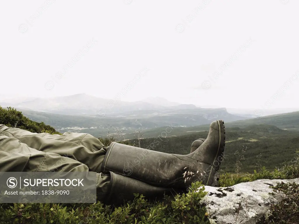 Man Wearing Rubber Boots Relaxing Outdoor