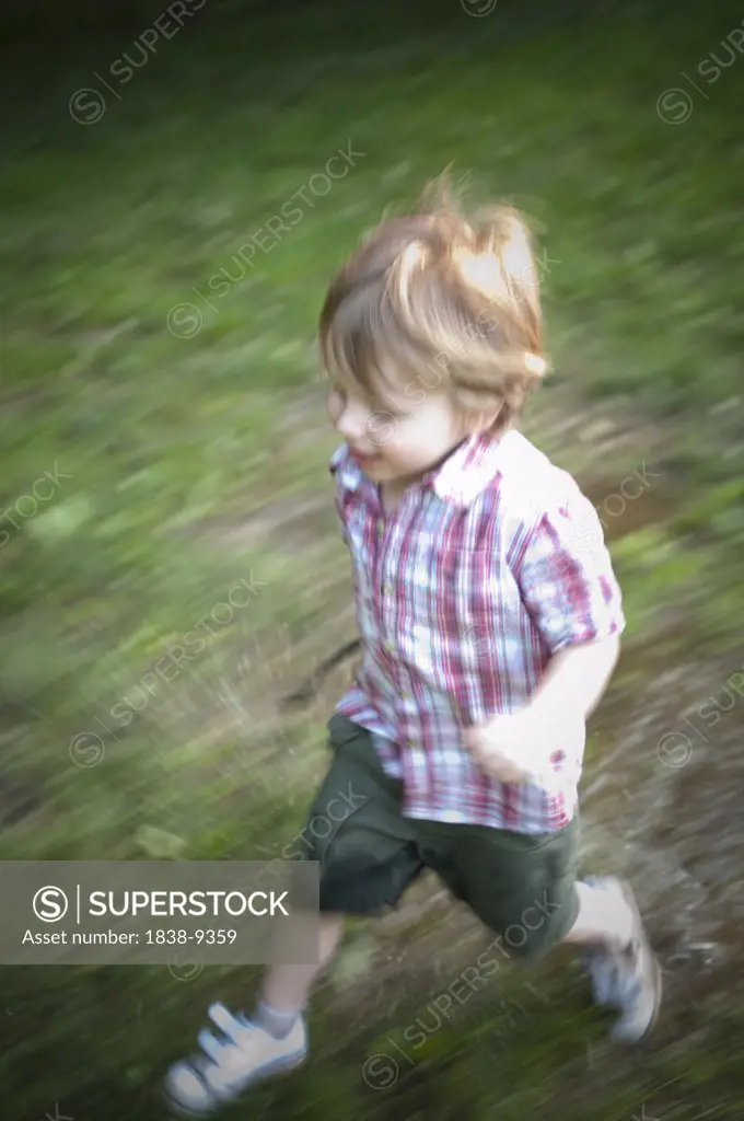Blurred Young Boy Running