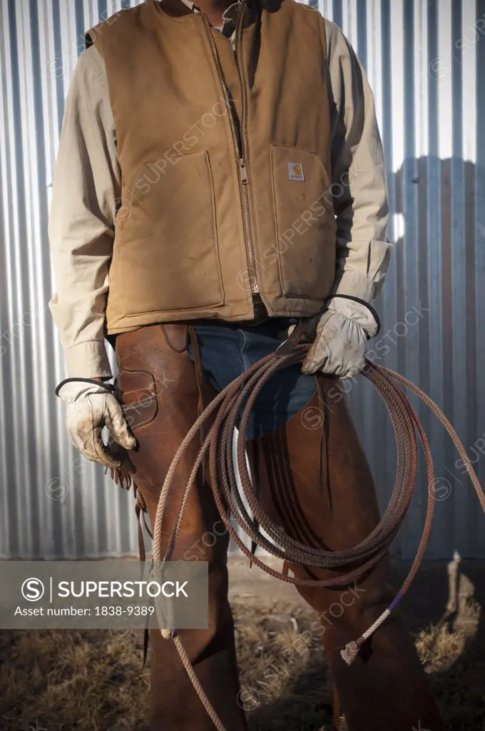 Cowboy in Chaps Holding Rope