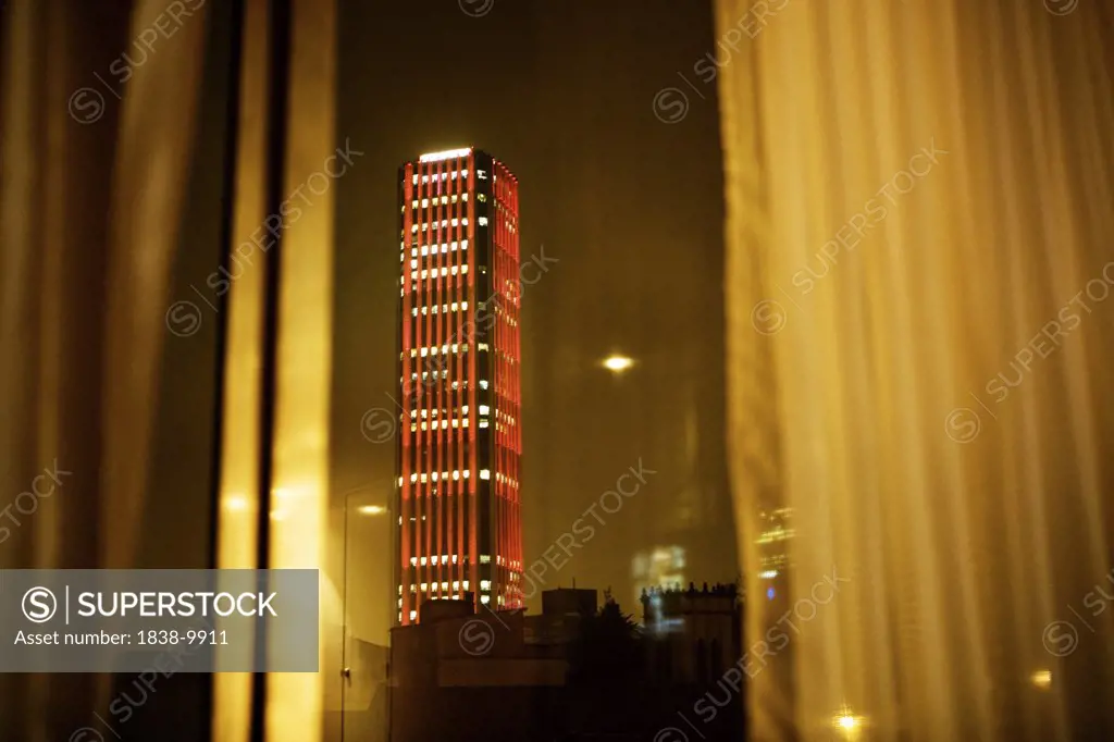 Skyscraper through Curtained Window at Night, Bogota, Colombia