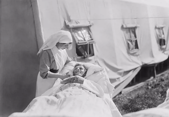 Nurse cheering up Injured American Soldier, American Military Hospital No. 5, supported by American Red Cross, Auteuil, France, Lewis Wickes Hine, American National Red Cross Photograph Collection, September 1918