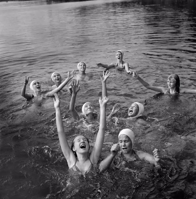 Group of Girls waiting to Catch Large Rubber Ball in Lake, National Music Camp, Interlochen, Michigan, USA, Arthur S. Siegel, U.S. Farm Security Administration, August 1942