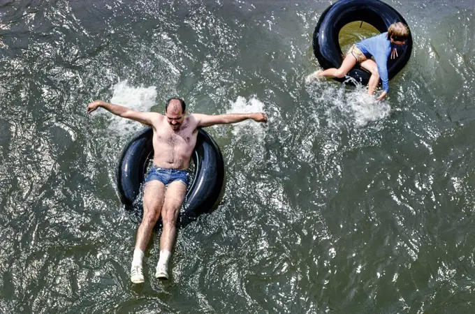 Two People floating in Inner Tube, High Angle View, Phoenicia, New York, USA, John Margolies Roadside America Photograph Archive, 1978