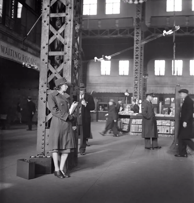 Member of Women's Army Auxiliary Corps waiting for Train, Union Station, Chicago, Illinois, USA, Jack Delano, U.S. Office of War Information, January 1943