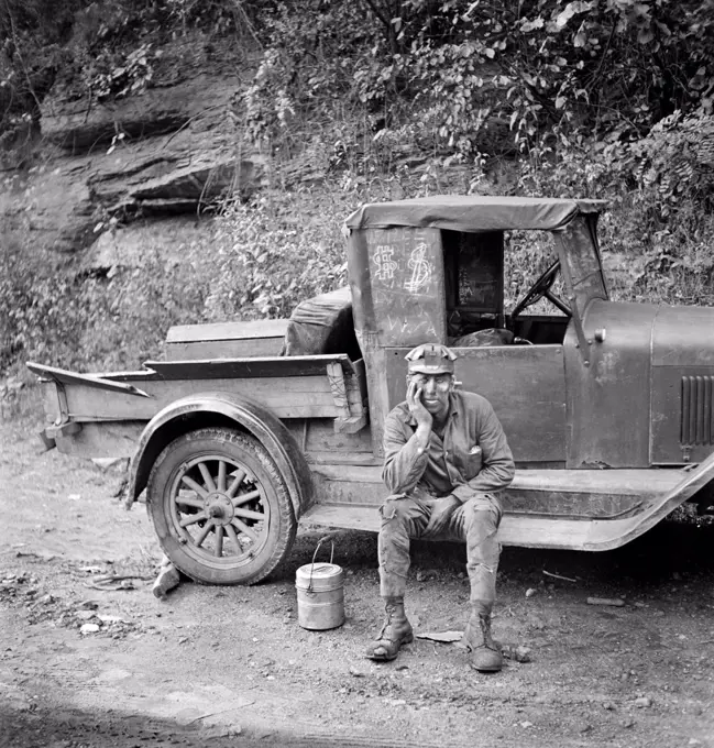 Miner waiting for ride home, Capels, West Virginia, USA, Marion Post Wolcott, U.S. Farm Security Administration, September 1938