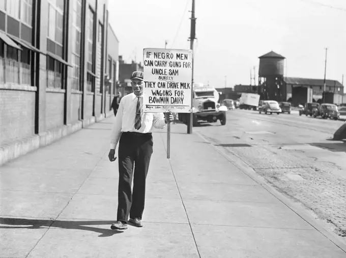 Man with Protest Sign outside Bowman Dairy, Chicago, Illinois, USA, John Vachon, U.S. Office of War Information/U.S. Farm Security Administration, July 1941