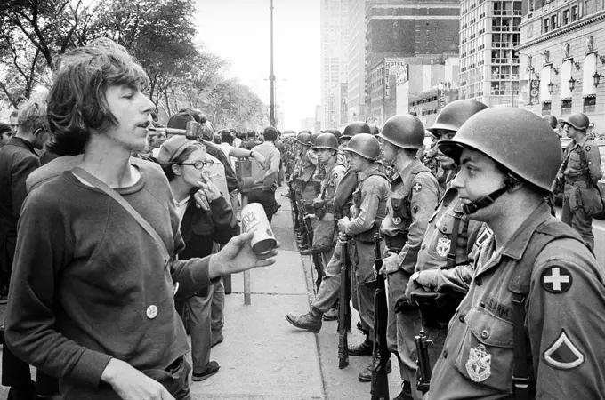 Group of People standing in front of row of National Guard soldiers, across from Hilton Hotel at Grant Park during Democratic National Convention, Chicago, Illinois, USA, Warren K. Leffler, August 26, 1968