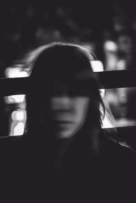 Dark Blurred Portrait of Young Woman