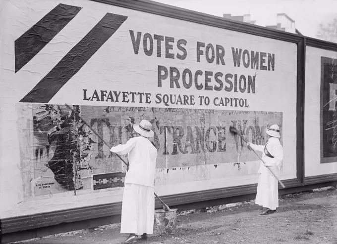 Two Women Putting Up Poster for Women's Suffrage Parade, Washington DC, USA, circa 1914