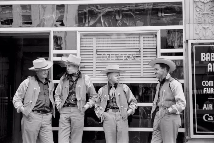 Four Cowboys Dressed Alike in Front of Bar, Billings, Montana, USA, Arthur Rothstein for Farm Security Administration, July 1939