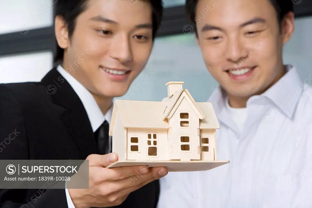 Real estate agent selling a house to customer