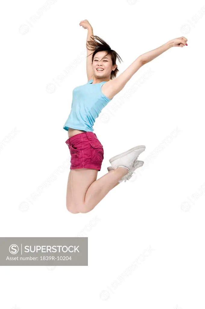 Young woman jumping in mid_air