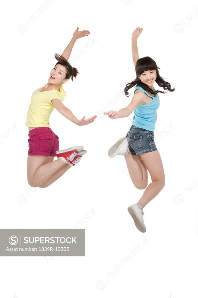 Young women jumping in mid_air