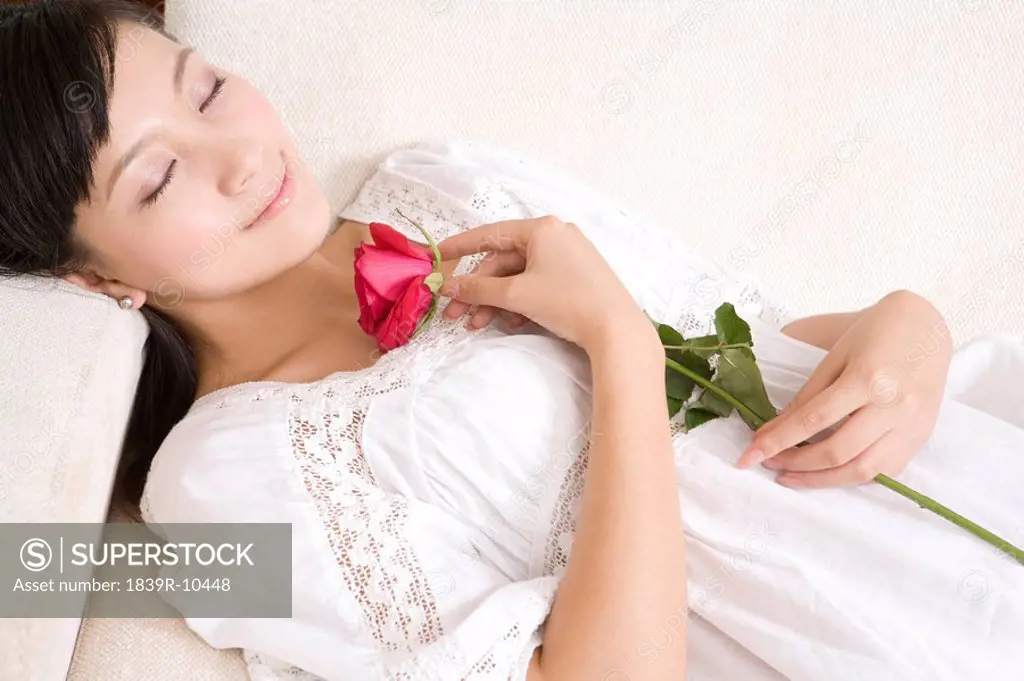 Asian woman with rose