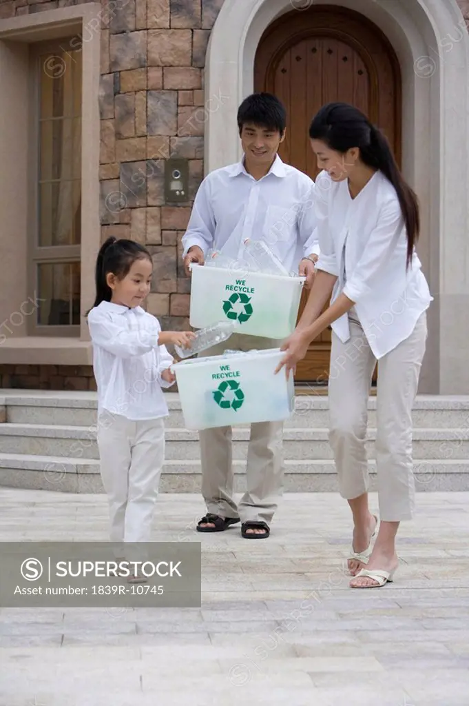 Family doing recycling